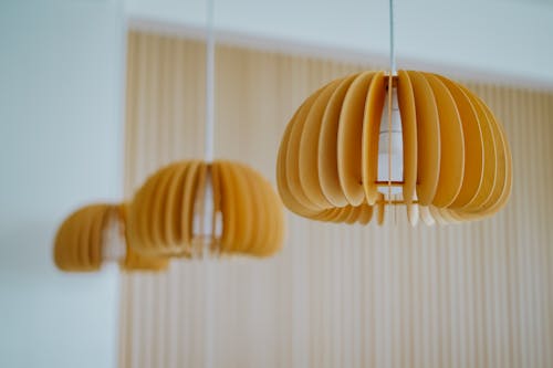Three yellow pendant lamps hanging from the ceiling