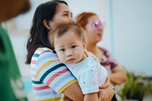 Woman Holding Her Child 