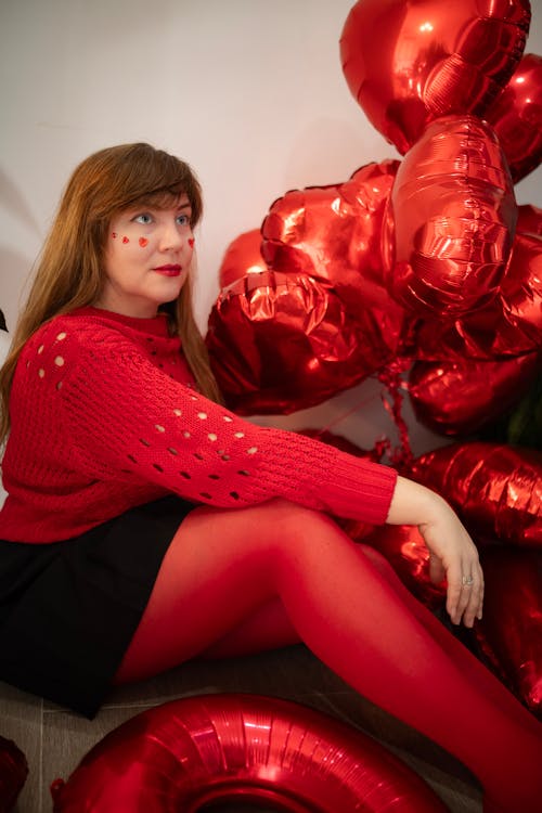 Free Woman Sitting Among Red Balloons  Stock Photo