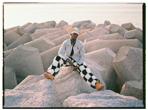 Free Man in Hat, Shirt and Checkered Trousers Stock Photo