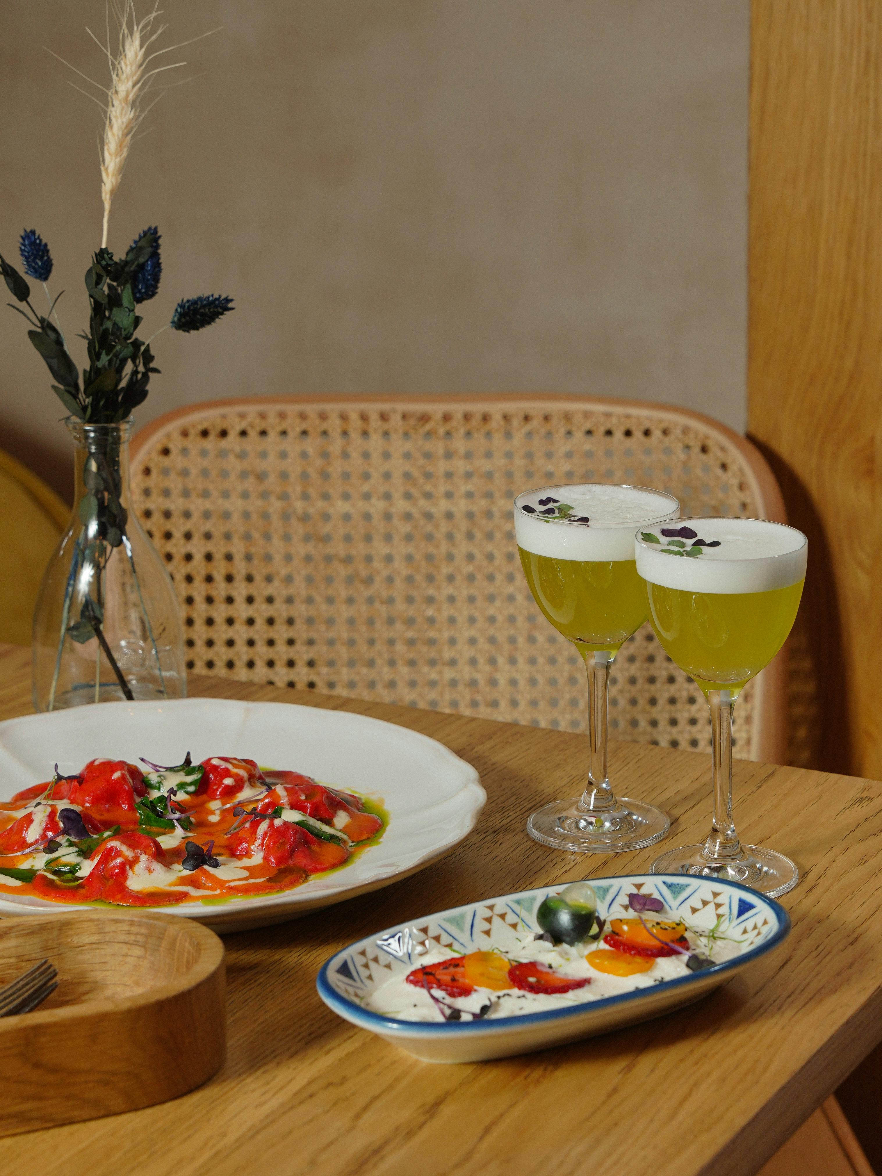 Food and Cocktails Standing on a Table