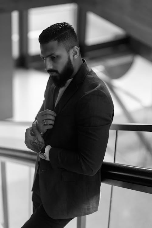 Black and White Photo of a Bearded Man in a Suit 