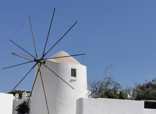 Free Traditional Greek windmill on a sunny day in Antiparos, perfect for travel inspiration. Stock Photo