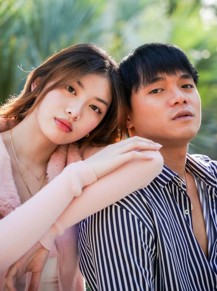 Young couple posing head to head