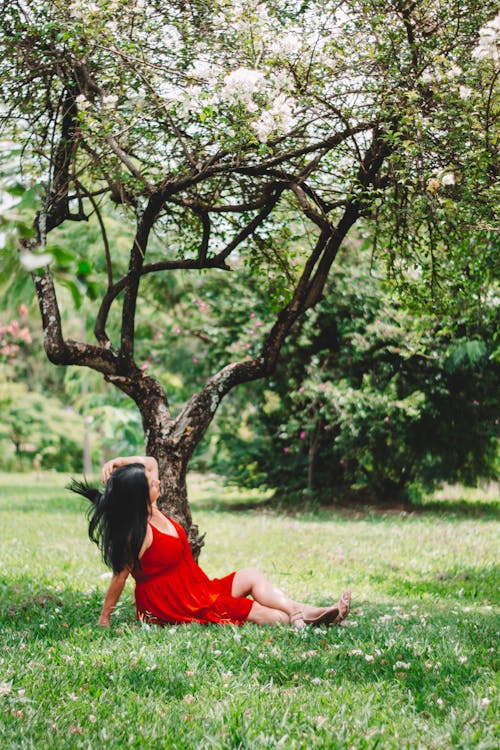 Woman Sitting under Tree
