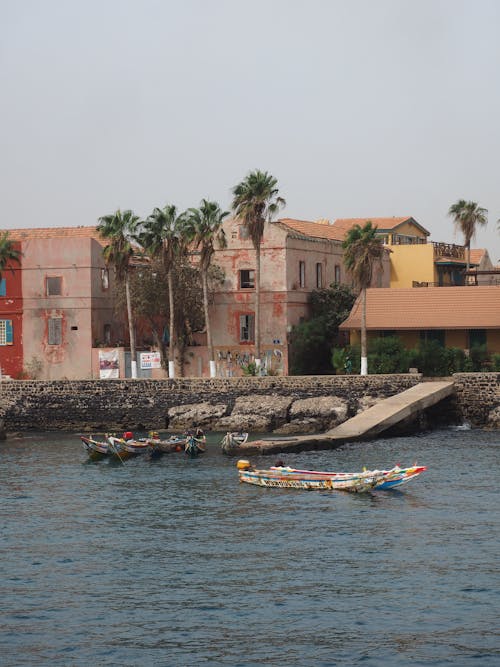 Canoes Near Pier in Town