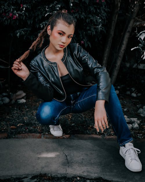 Young Model with Braid Wearing Leather Jacket and Jeans
