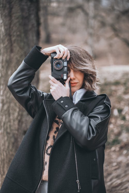 Woman Looking Through Camera