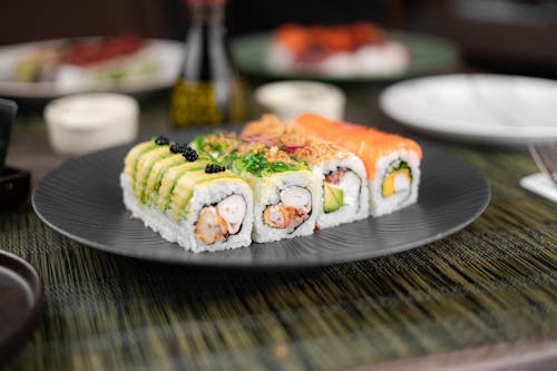 Sushi on a plate with a knife and fork