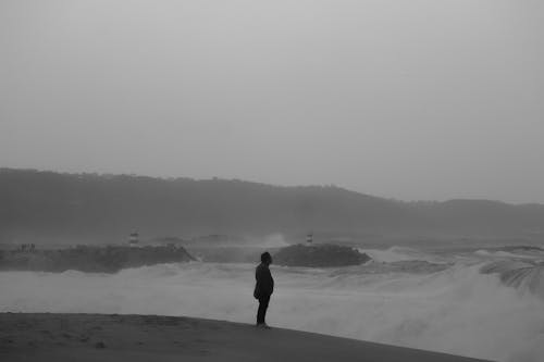 Man on Sea Coast in Black and White