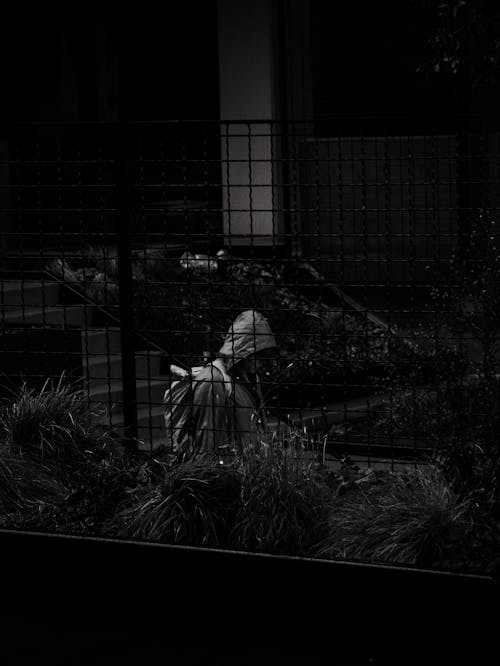 Street shot of a person wearing a raincoat 