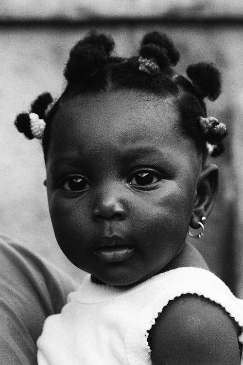 A black and white photo of a young girl with hair