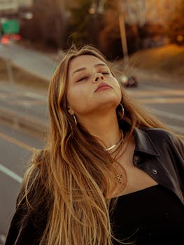 Calm portrait of a woman with long hair enjoying the sunset in Atlanta.