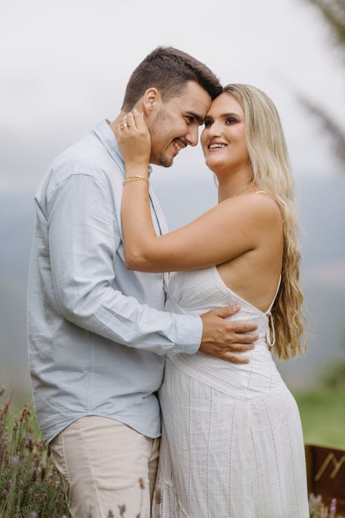 Smiling Couple in White Dress and Shirt