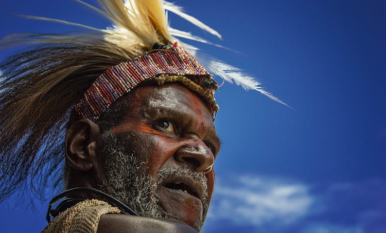 Photography Of Man In Feather Headband