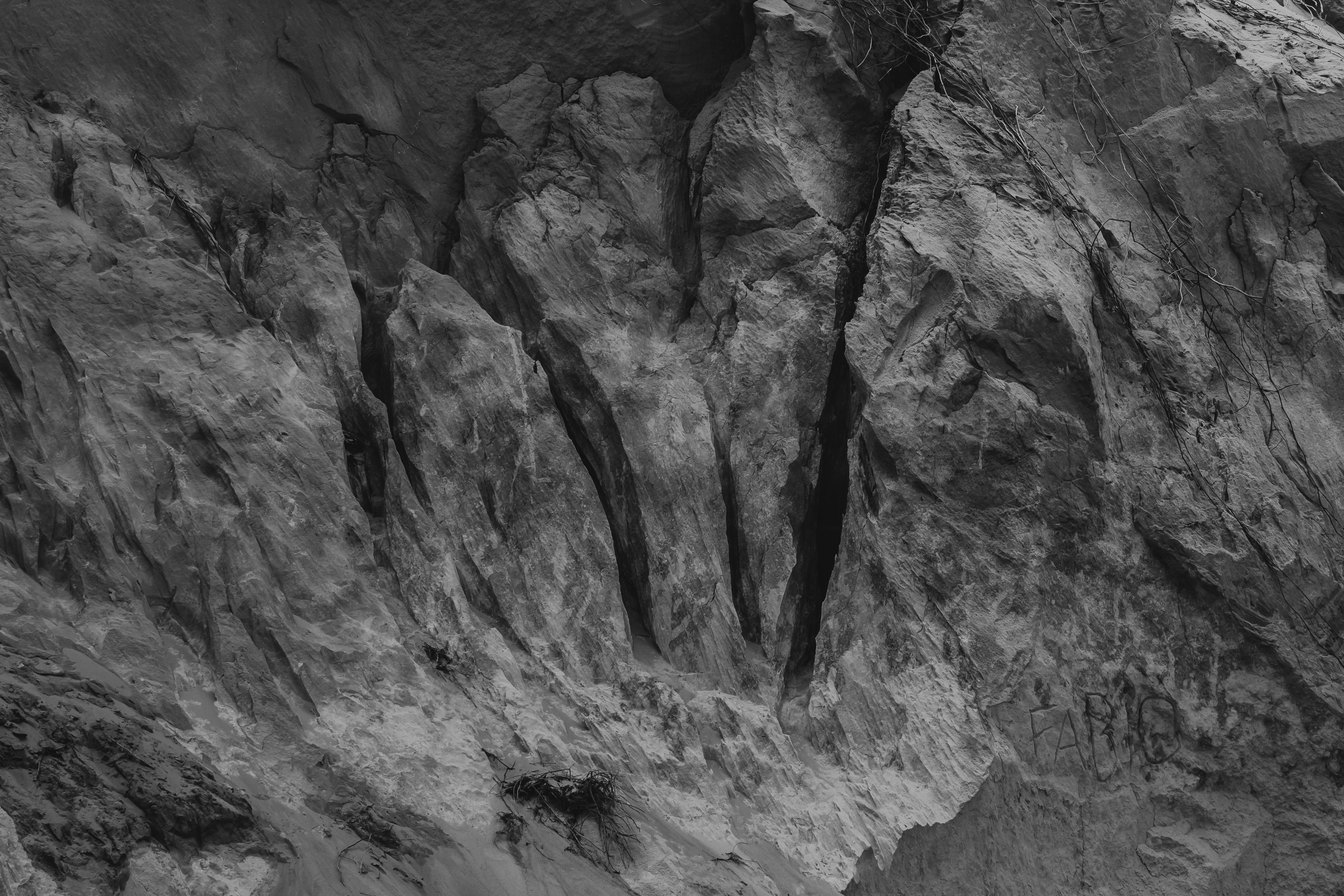 Black and white photo of Canoa Quebrada's cliffs capturing rugged textures and formations.