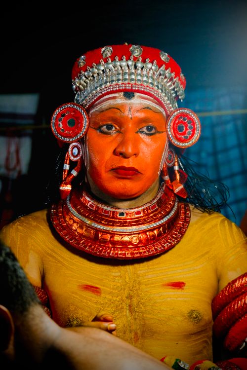 Free Portrait of a Theyyam performer in traditional costume and makeup, showcasing cultural artistry and heritage. Stock Photo