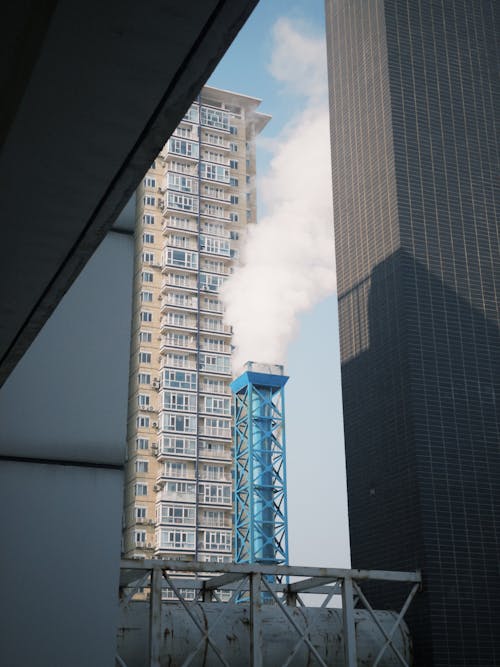 A blue smoke machine is blowing out of a building