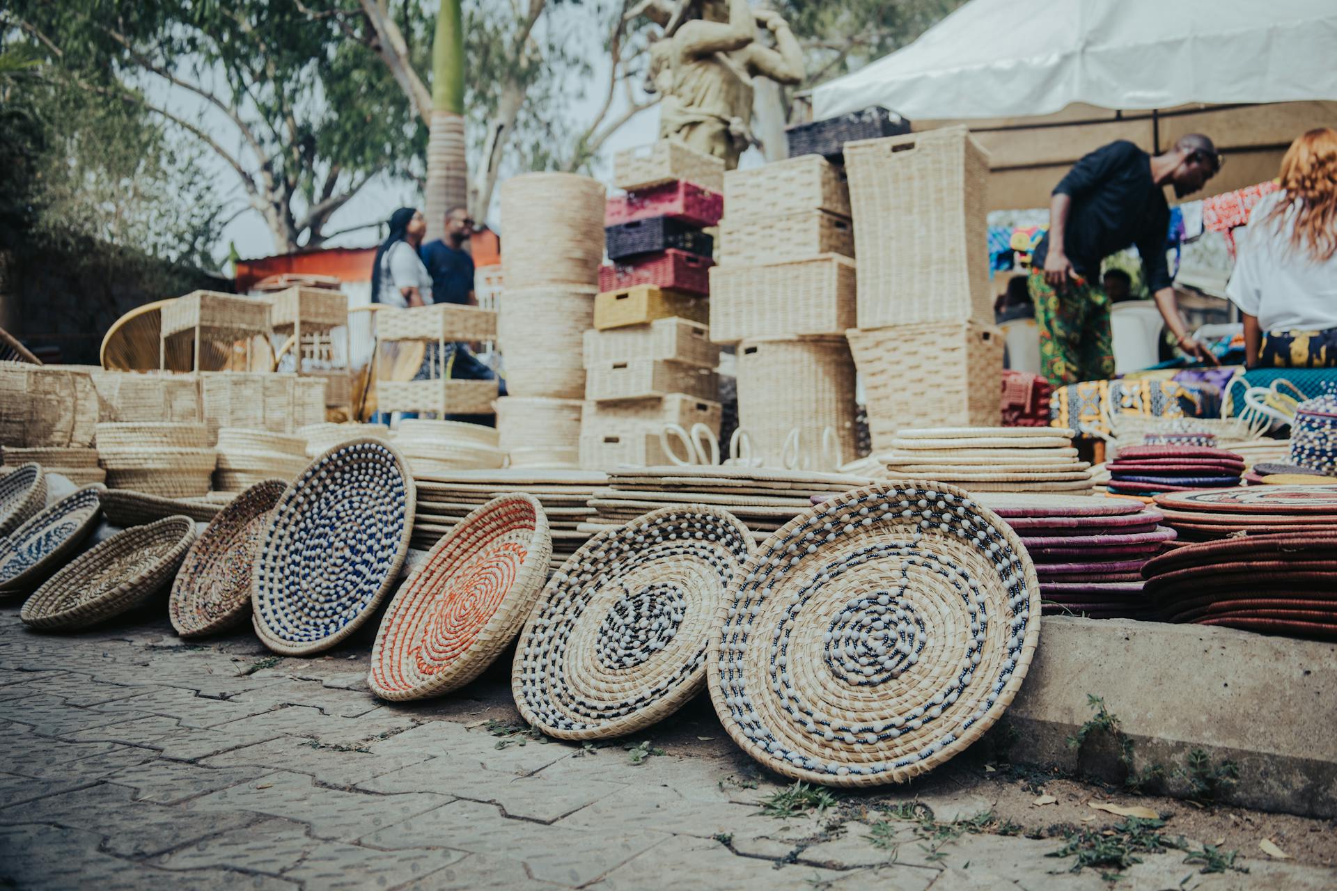 Vibrant display of handmade woven baskets at an open-air market in Abuja, Nigeria.