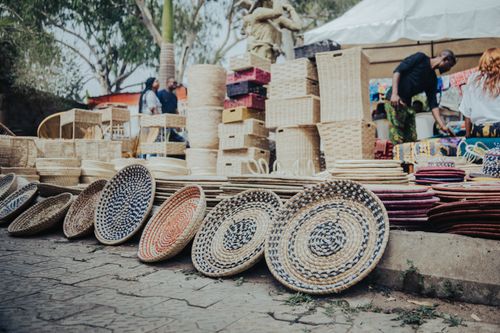 Free Vibrant display of handmade woven baskets at an open-air market in Abuja, Nigeria. Stock Photo