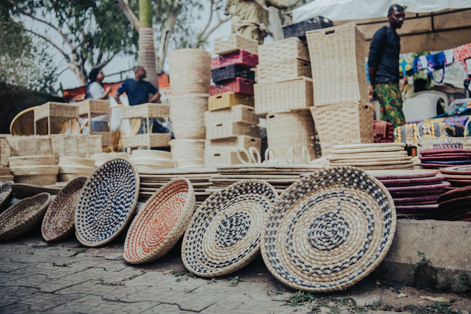Colorful woven baskets displayed at an outdoor market in Abuja, Nigeria.