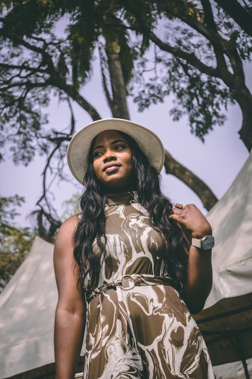 Portrait of a Long-Haired Model Wearing a Dress and a Fedora