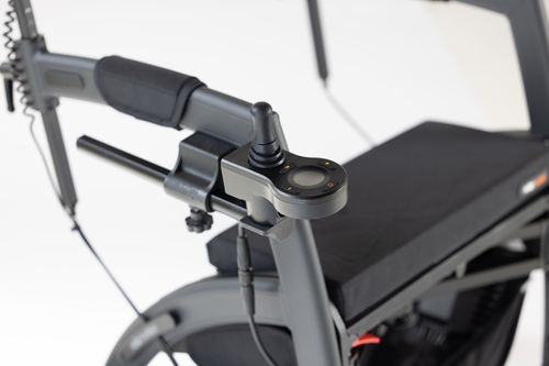 Free Close-up of a sleek, modern motorized wheelchair featuring advanced joystick controls on a white background. Stock Photo