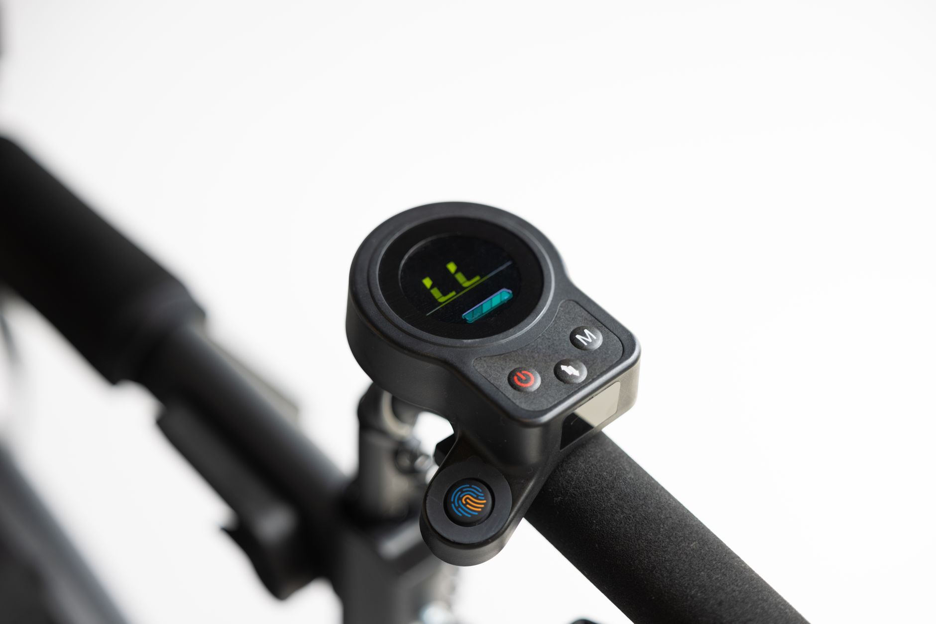 Close-up of electric scooter handlebar featuring digital display and control buttons.
