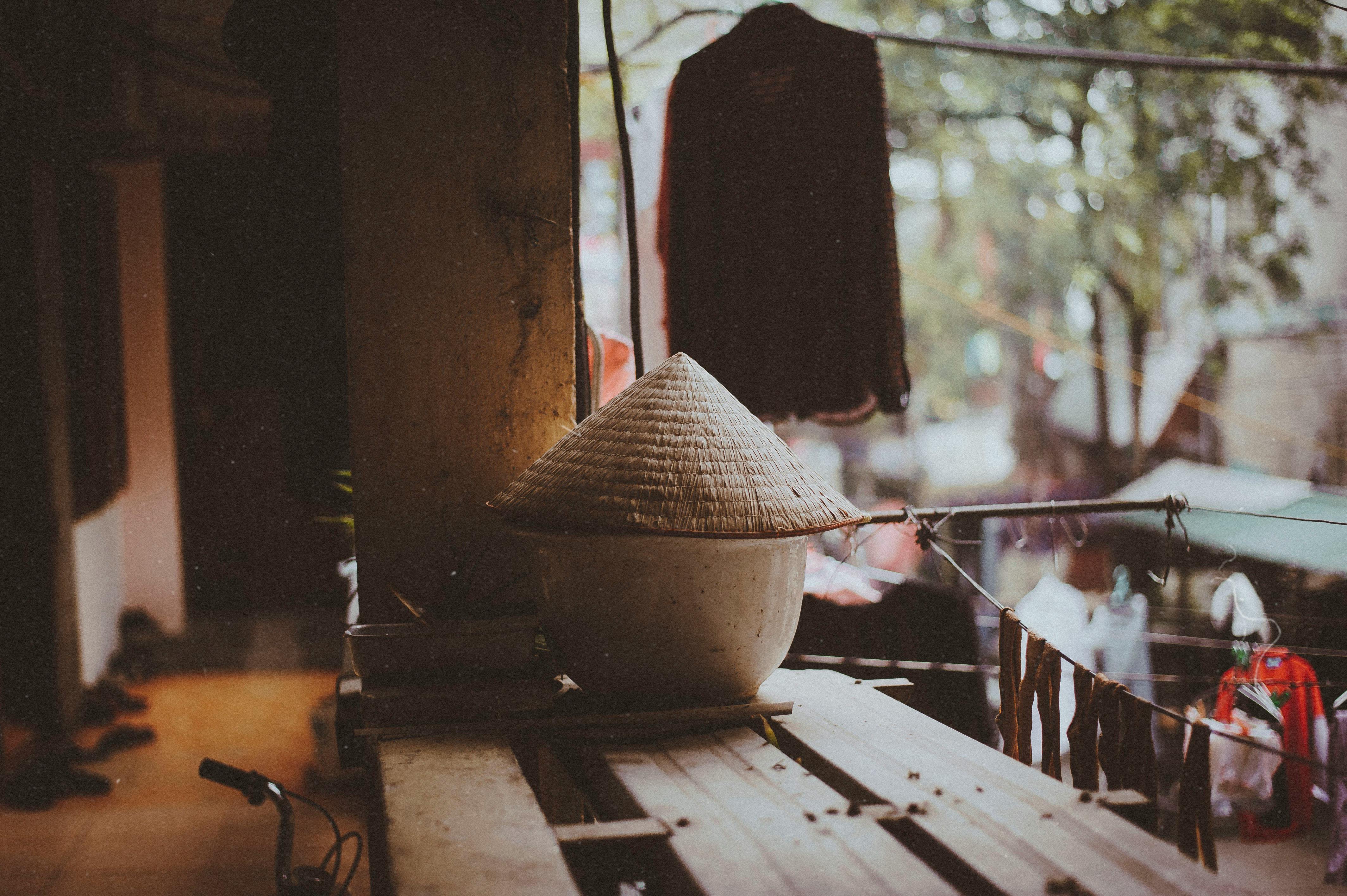 round white pot on wood plank