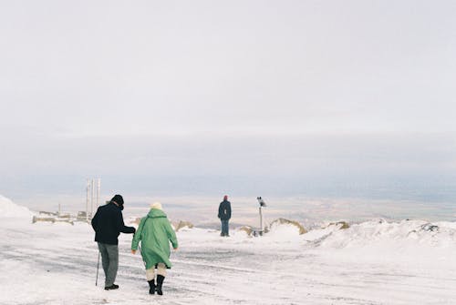 Elderly Couple on Hilltop in Winter