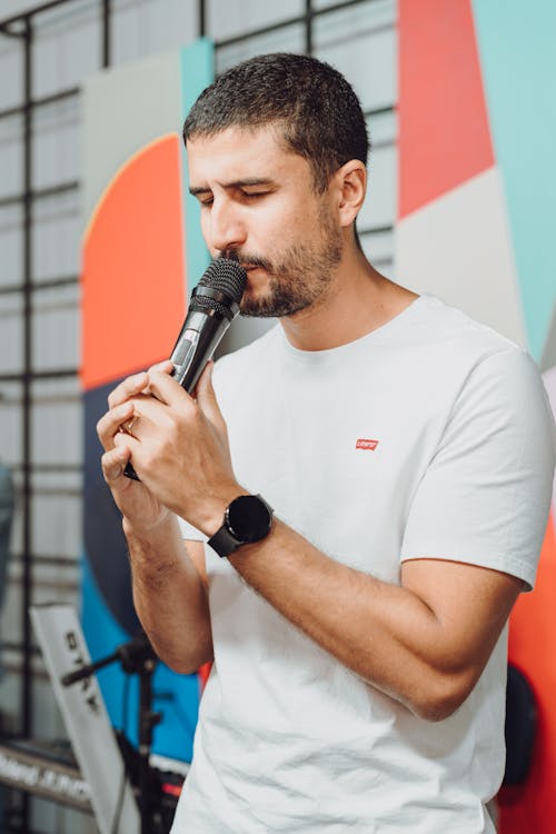 Man in White T-shirt and with Microphone