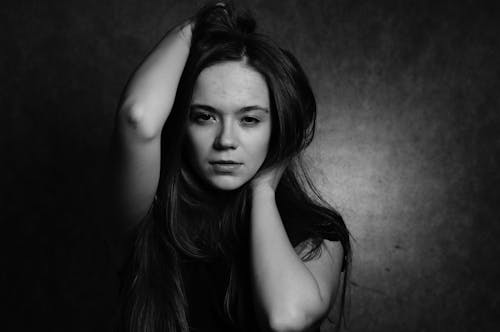 A black and white photo of a woman with long hair