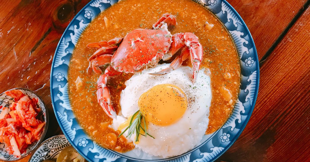 Street food market stalls with grilled specialties in Jeju