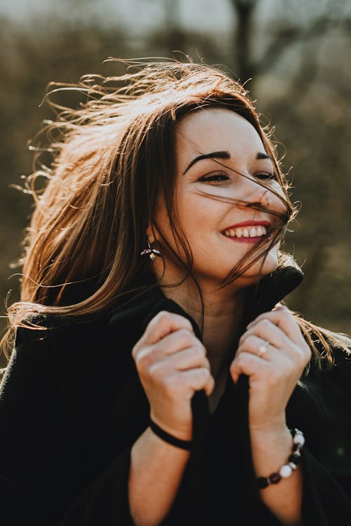 Woman Wearing Jewelry on Windy Day