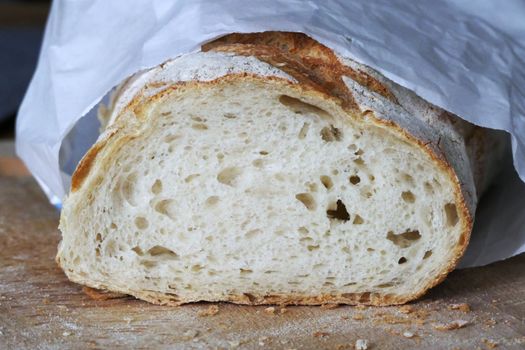 A detailed close-up of a fresh slice of white bread, showcasing its texture.