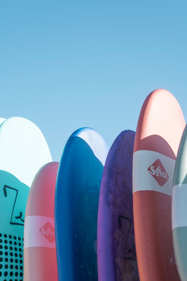 Colorful Surfboards Under Clear Sky