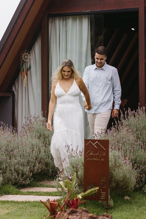 A bride and groom walk out of their cabin