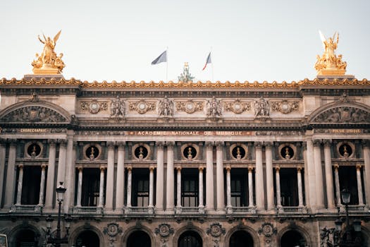 Elegant facade of Palais Garnier Opera House in Paris, France captured in daylight.