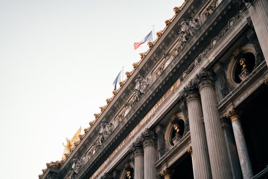 Classic view of the ornate facade of Palais Garnier in Paris, showcasing French architectural grandeur.