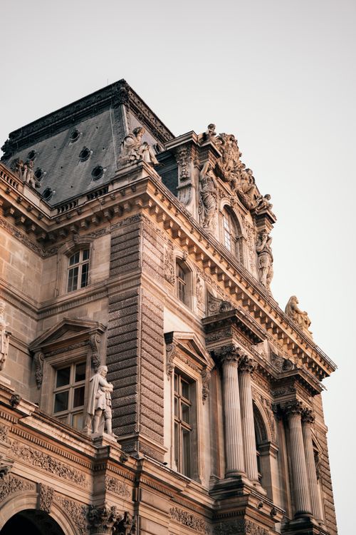 Free Detailed view of a Renaissance facade in Paris, showcasing intricate sculptures and classic design elements. Stock Photo
