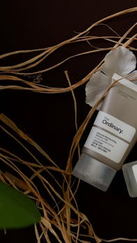 The Ordinary skincare product showcased with a dark aesthetic and natural elements.