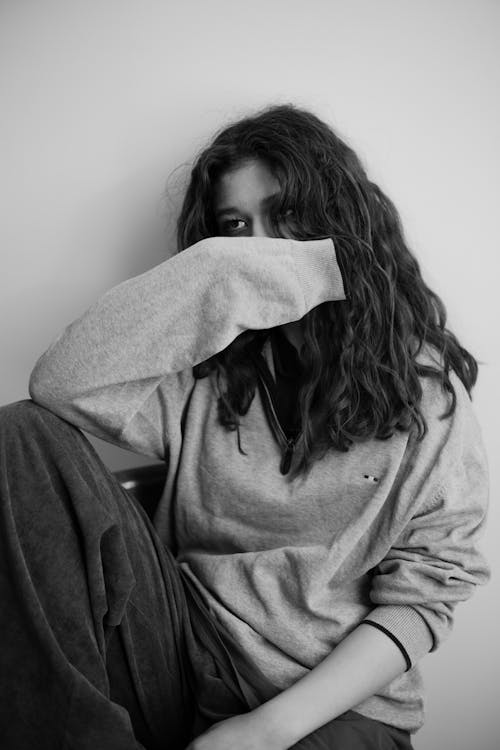 Woman Sitting in Black and White