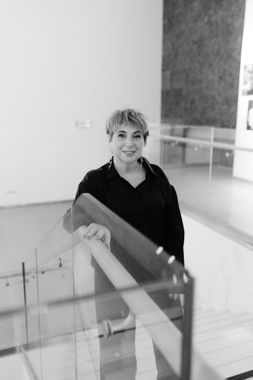 Smiling Woman on Stairs