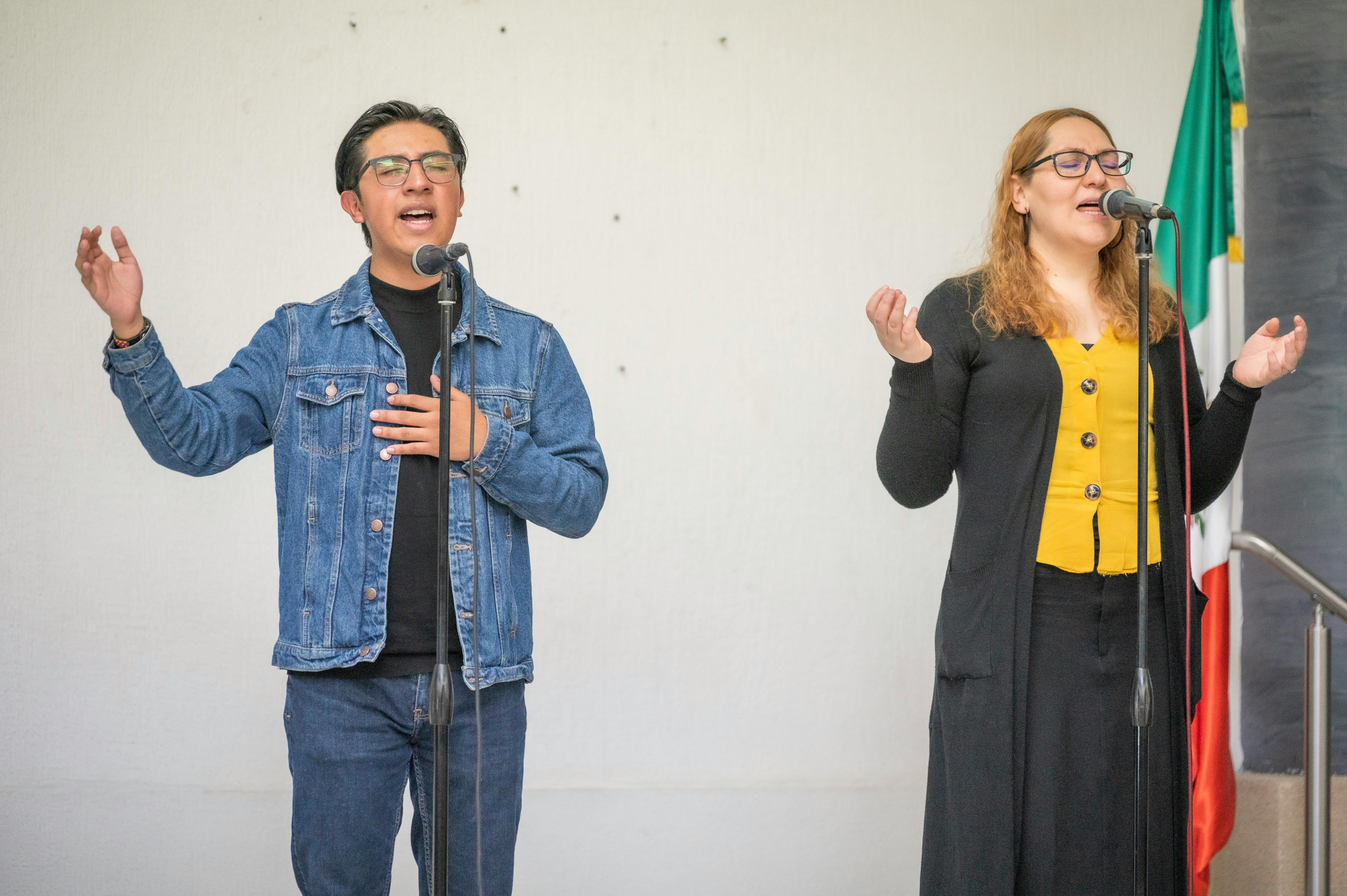 woman and man singing at event