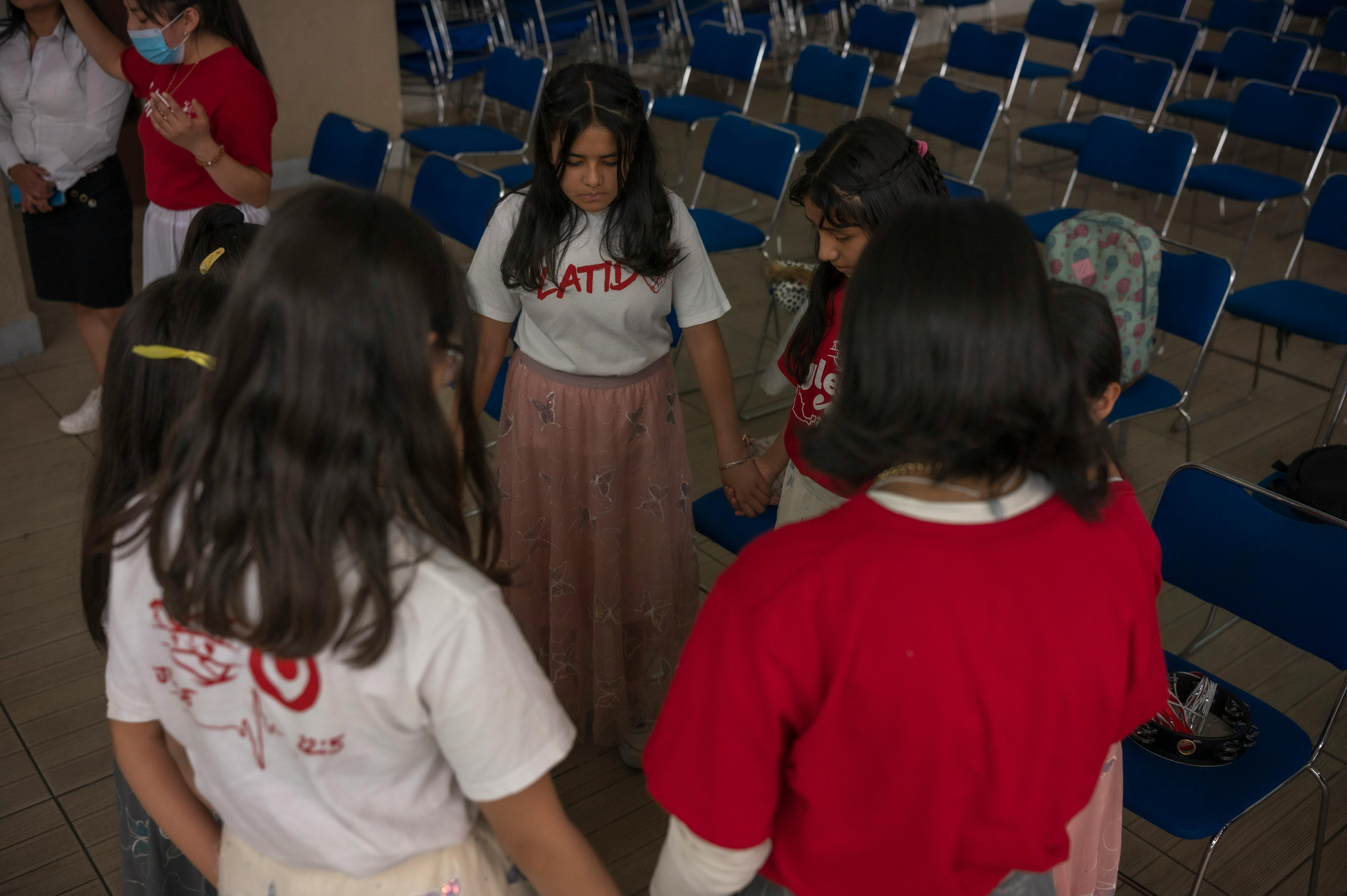 Students attending a university society fair in a crowded campus hall