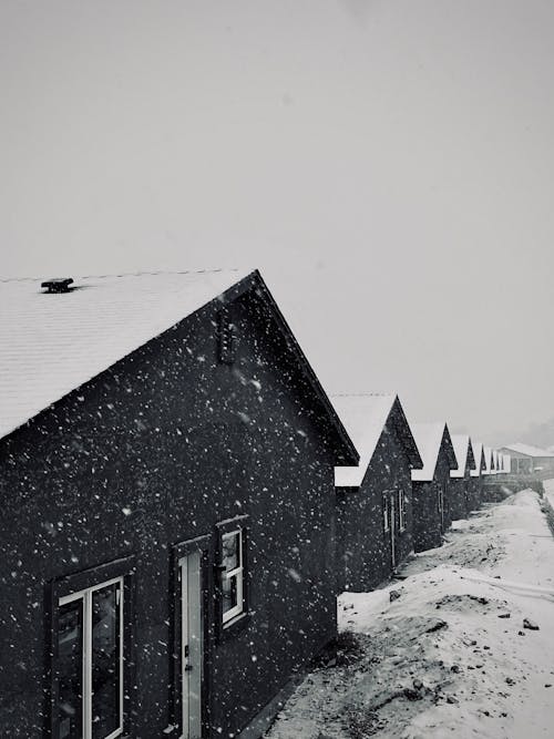 A black and white photo of a snowy building