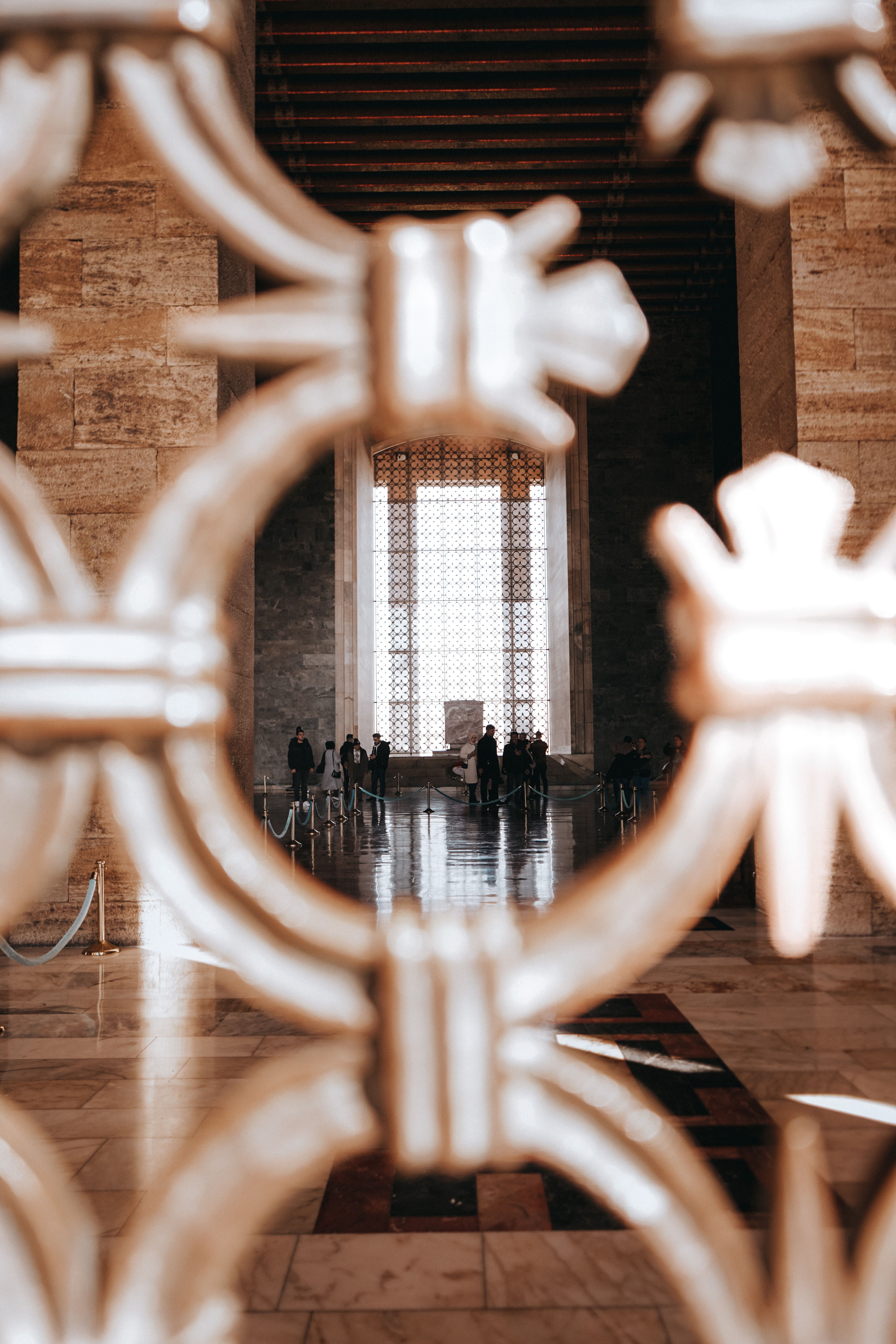 The view from inside a building through a metal gate · Free Stock Photo