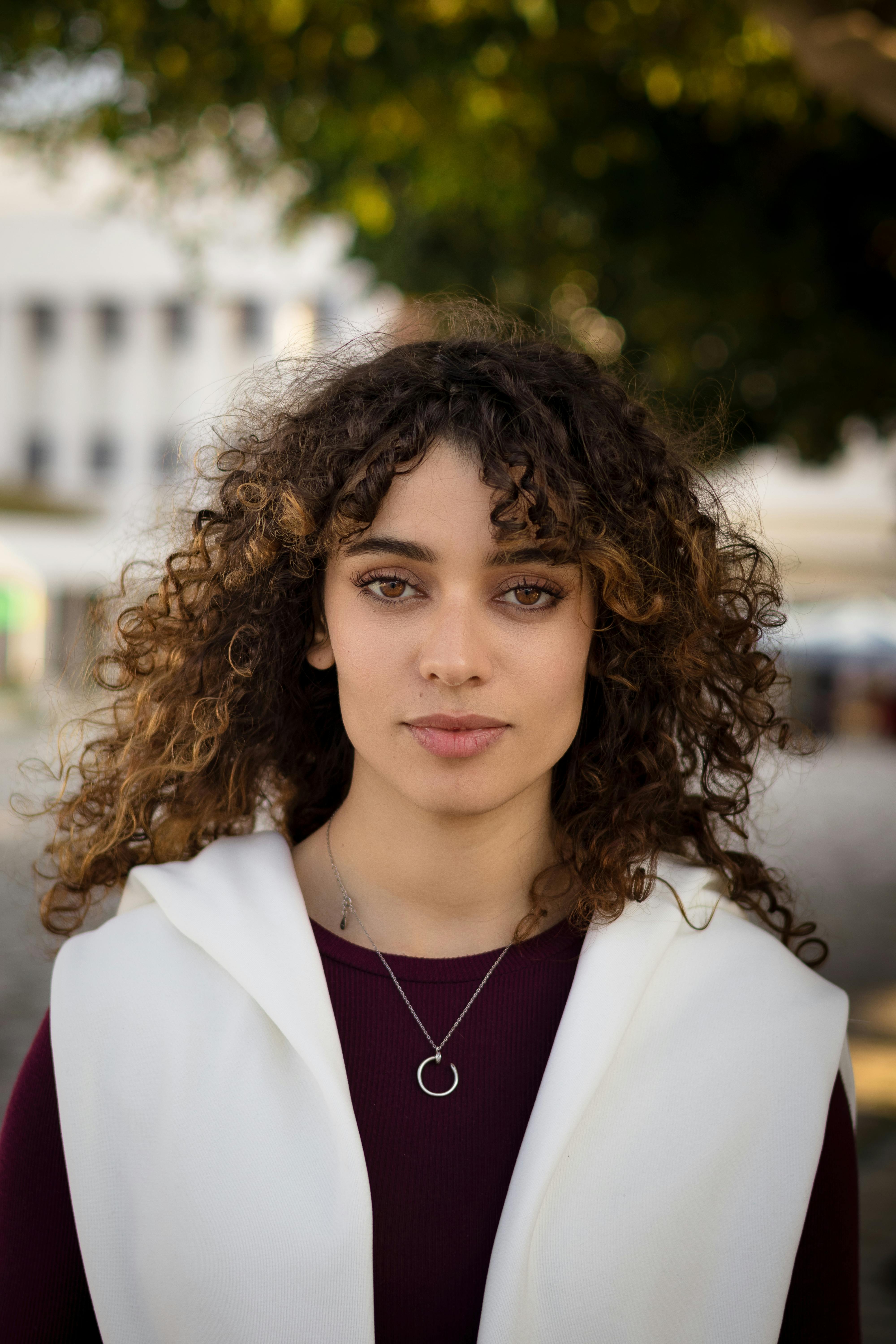 Beautiful Curly Haired Brunette Woman · Free Stock Photo