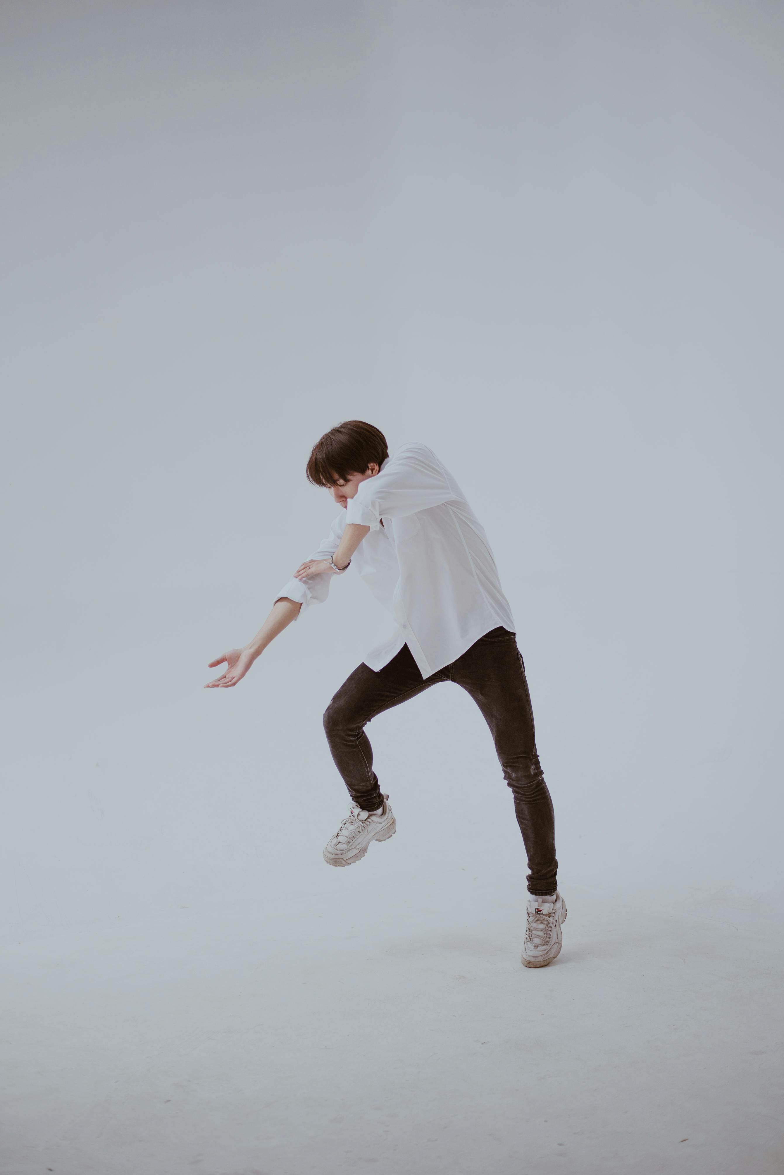 dancing man in white room