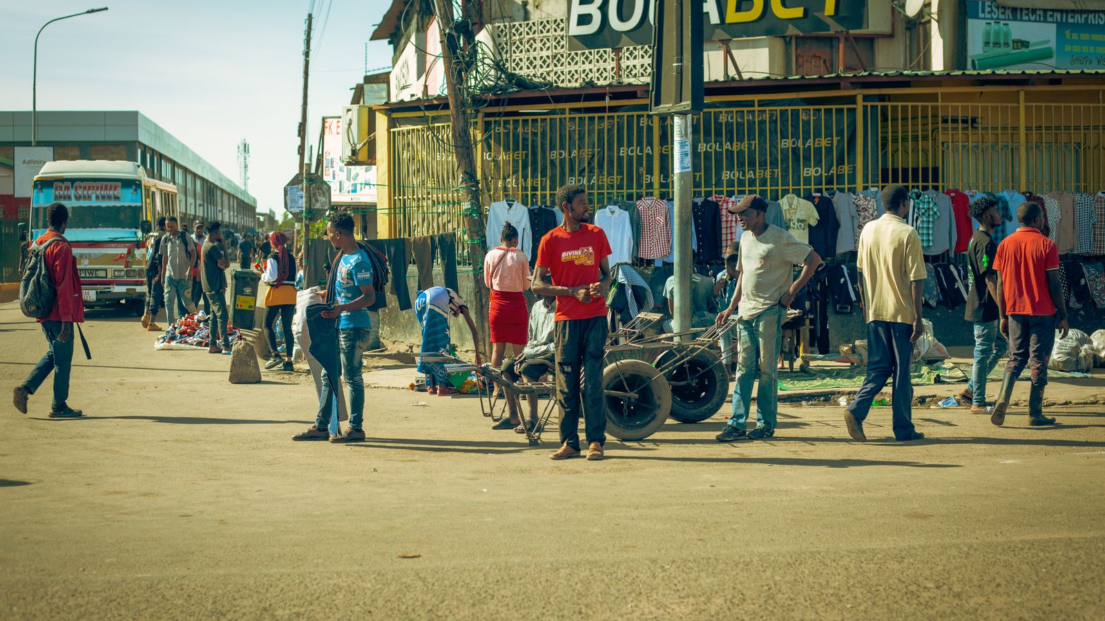 Men and bazaar on street in town, Eritrea